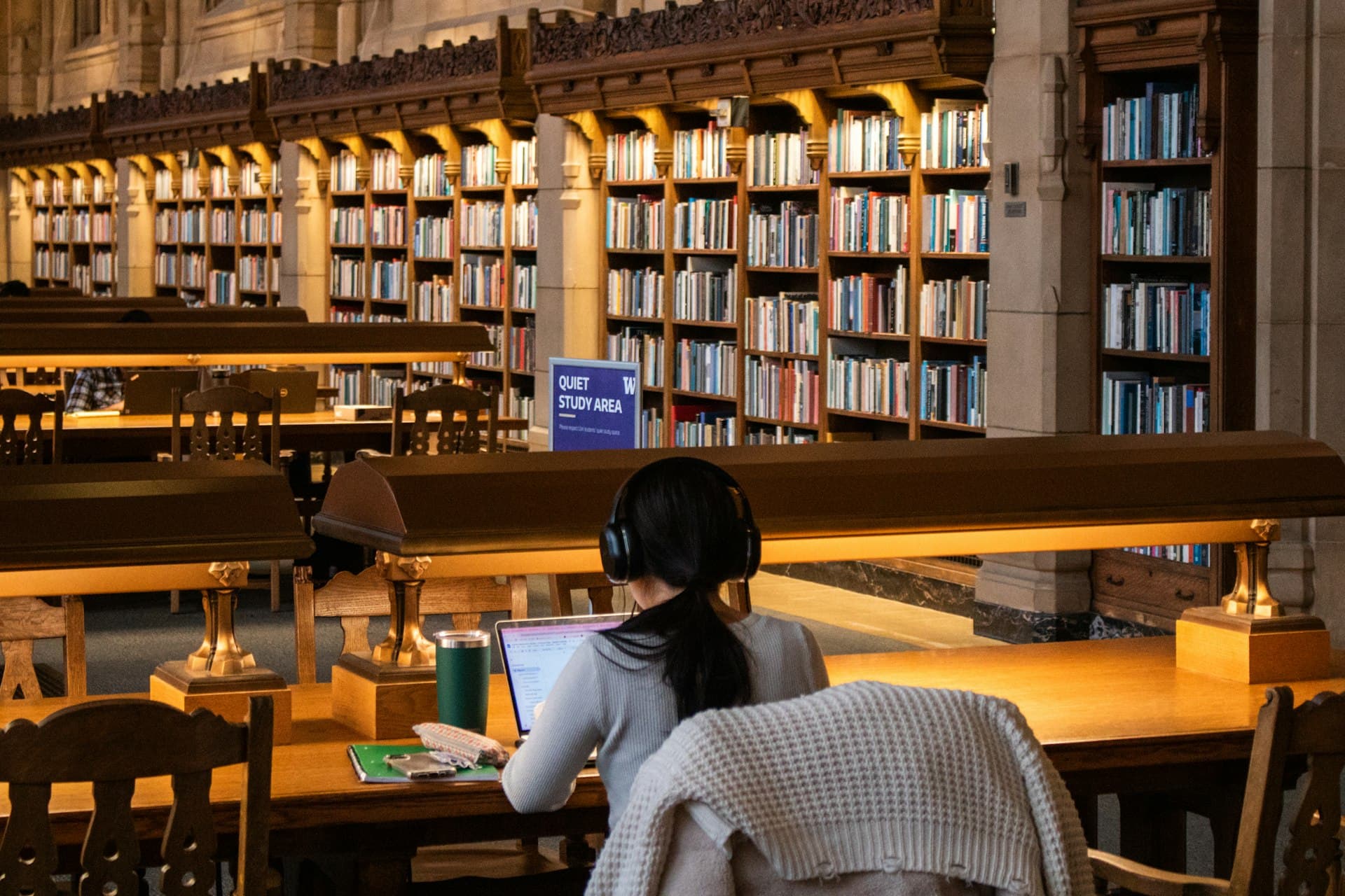Scholars reviewing research materials in an academic library setting